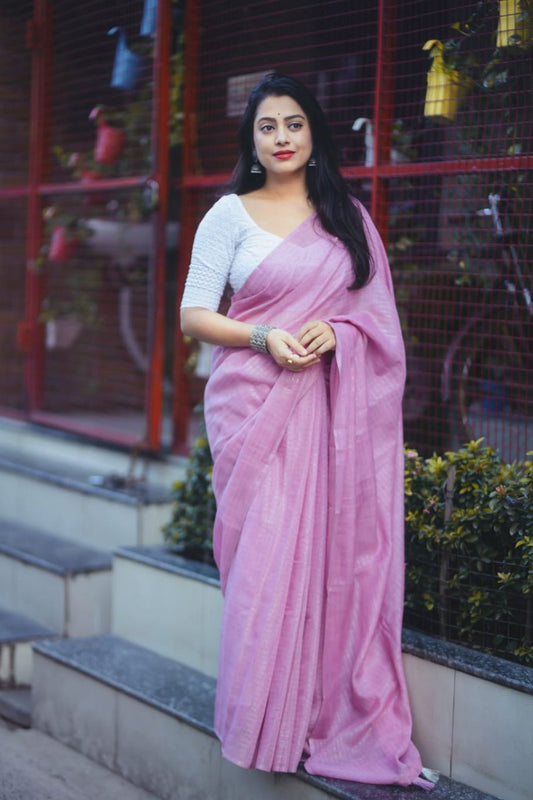 soft linen saree with allover silver zari woven linings.
